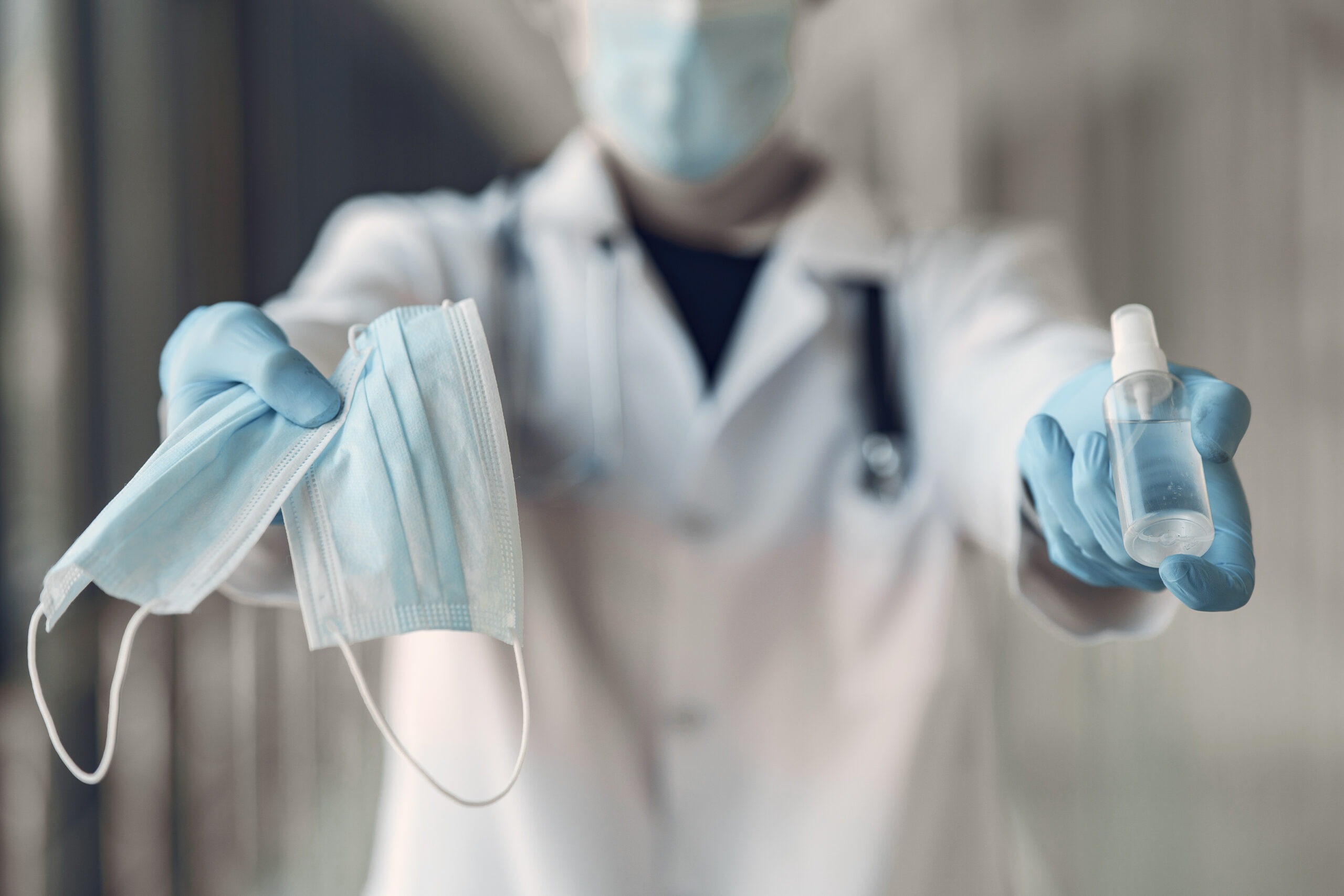 Doctor with antiseptic. Coronavirus theme.